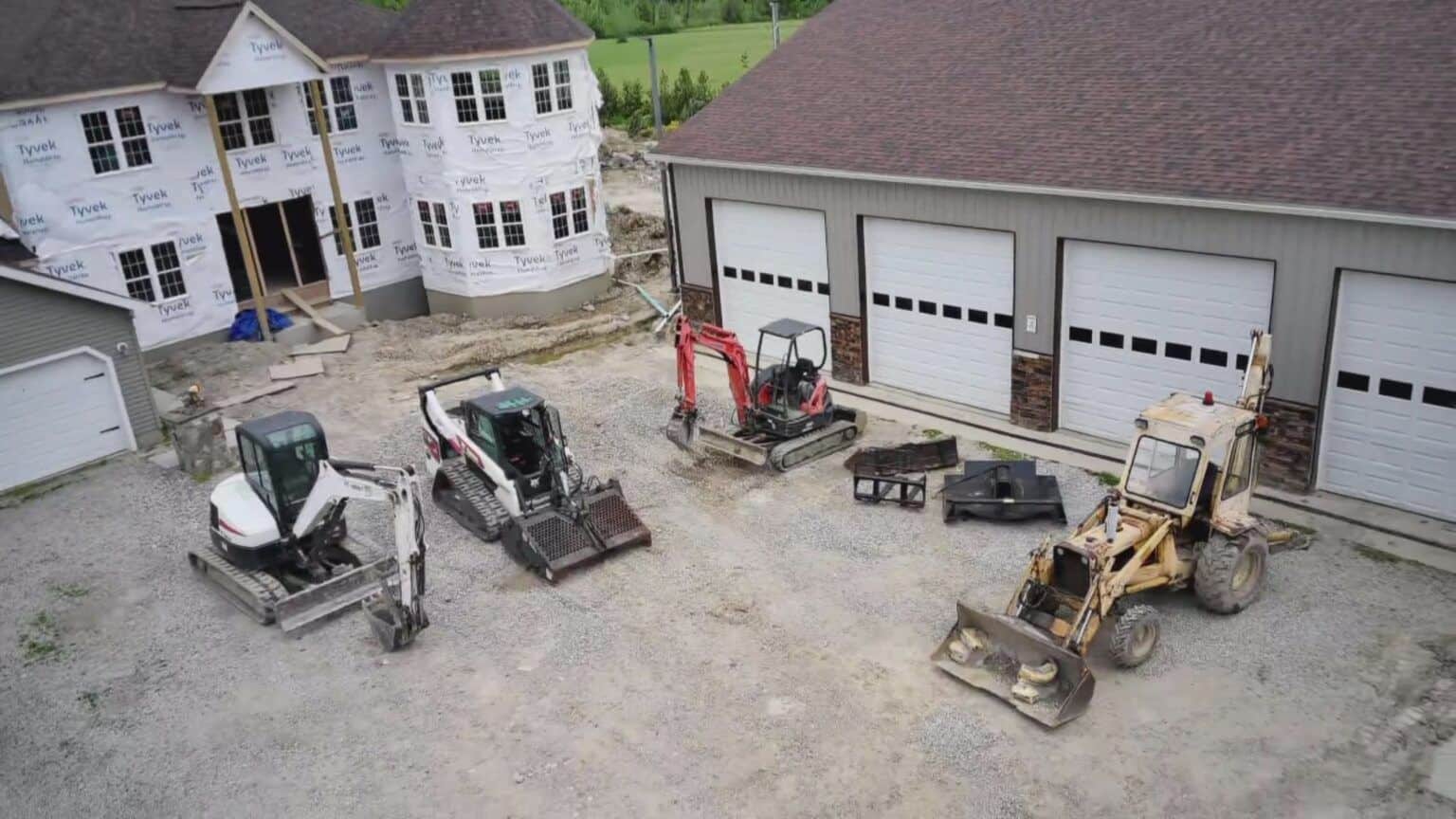 S&K Drain Cleaning excavation equipment fleet parked at a Northeast Ohio jobsite